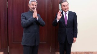 In this photo released by China's Xinhua News Agency, India's External Affairs Minister Subrahmanyam Jaishankar, left, and Chinese Foreign Minister Wang Yi pose for a photo as they meet on the sidelines of a meeting of the foreign ministers of the Shanghai Cooperation Organization (SCO) in Moscow, Russia on Sept. 10, 2020. The Indian and Chinese foreign ministers have agreed that their troops should disengage from a tense border standoff, maintain proper distance and ease tensions in the Ladakh region where the two sides in June had their deadliest clash in decades.