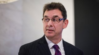 In this Jan. 17, 2019, file photo, Albert Bourla, chief executive officer of Pfizer pharmaceutical company, waits to ring the closing bell at the New York Stock Exchange (NYSE) in New York City.