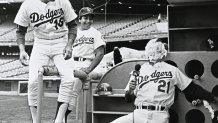 LOS ANGELES, CA - MAY 30, 1981 : Rick Monday #16 looks on after Steve Yeager #7 threw a pie in the face of Jay Johnstone #21 of the Los Angeles Dodgers during a TV interview at Dodger Stadium, Los Angeles, California. (Photo by Jayne Kamin-Oncea/Getty Images)