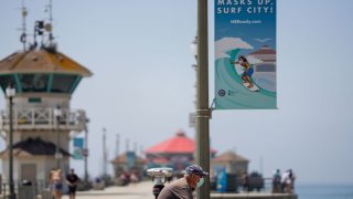 People enjoy a crisp Summer day near the Huntington Beach Pier, on Friday, Sept. 4, 2020 in Huntington Beach, CA. As California braces for a looming heatwave Gov. Gavin Newsom issued an emergency proclamation aimed at shoring up the states energy capacity with scorching temperatures being set to sear the state through the Labor Day weekend.