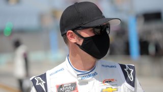 HOMESTEAD, FLORIDA - JUNE 13: Dale Earnhardt Jr., driver of the #8 Hellmann's Chevrolet, walks the grid prior to the NASCAR Xfinity Series Hooters 250 at Homestead-Miami Speedway on June 13, 2020 in Homestead, Florida.