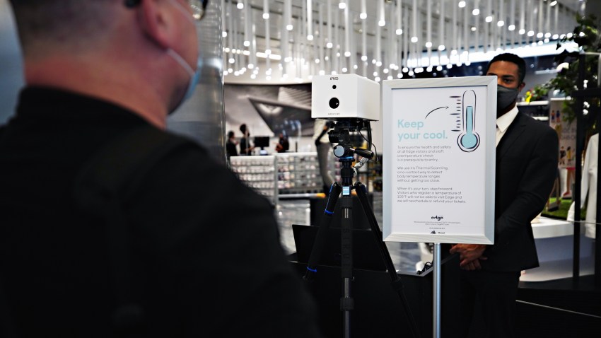 A visitors temperature is taken with an Iris Thermal Scanning device at the entrance to Edge observation deck at Hudson Yards as the city continues Phase 4 of re-opening following restrictions imposed to slow the spread of coronavirus on September 4, 2020 in New York City.