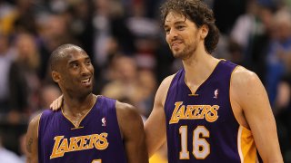 In this March 12, 2011, file photo, Kobe Bryant #24 and Pau Gasol #16 of the Los Angeles Lakers react after a 96-91 win against the Dallas Mavericks at American Airlines Center in Dallas, Texas.
