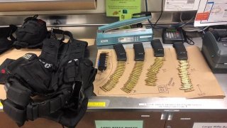 Escondido police provided this photo of tactical gear, ballistics and weapons that were allegedly stolen from an officer in San Diego.