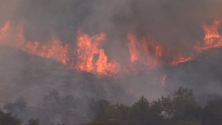 Unruly flames are seen coming from the ferocious Valley Fire.