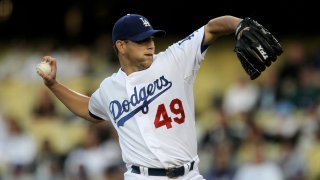 LOS ANGELES – MAY 8: Pitcher Charlie Haeger #49 of the Los Angeles Dodgers throws a knuckle ball against the Colorado Rockies on May 8, 2010 at Dodger Stadium in Los Angeles, California. (Photo by Stephen Dunn/Getty Images)