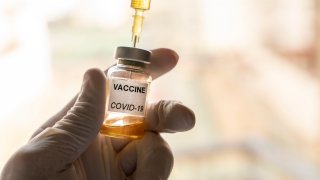 File Image: A Covid-19 vaccine vial and a syringe