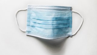 File Image: Surgical mask on white background