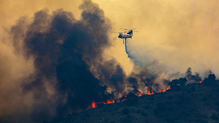 Chino Hills, California – OCTOBER 27: A chinook helicopter makes a water drop on Blue Ridge Fire on October 27, 2020 in Chino Hills, California. (Photo by Irfan Khan/Los Angeles Times via Getty Images)