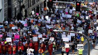 Hundreds protest on many issues including the Trump Administration’s efforts to replace the late Supreme Court Justice Ruth Bader Ginsburg and asking people to get out and vote during the Los Angeles Women’s March from Pershing Square to City Hall in Los Angeles on Saturday, October 17, 2020.