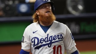 Justin Turner #10 of the Los Angeles Dodgers reacts after striking out against the Tampa Bay Rays during the first inning in Game Six of the 2020 MLB World Series at Globe Life Field on October 27, 2020, in Arlington, Texas.