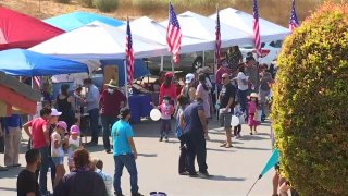 Hundred of people attend a family fair organized by a local church in Walnut, California on Oct. 17, 2020.