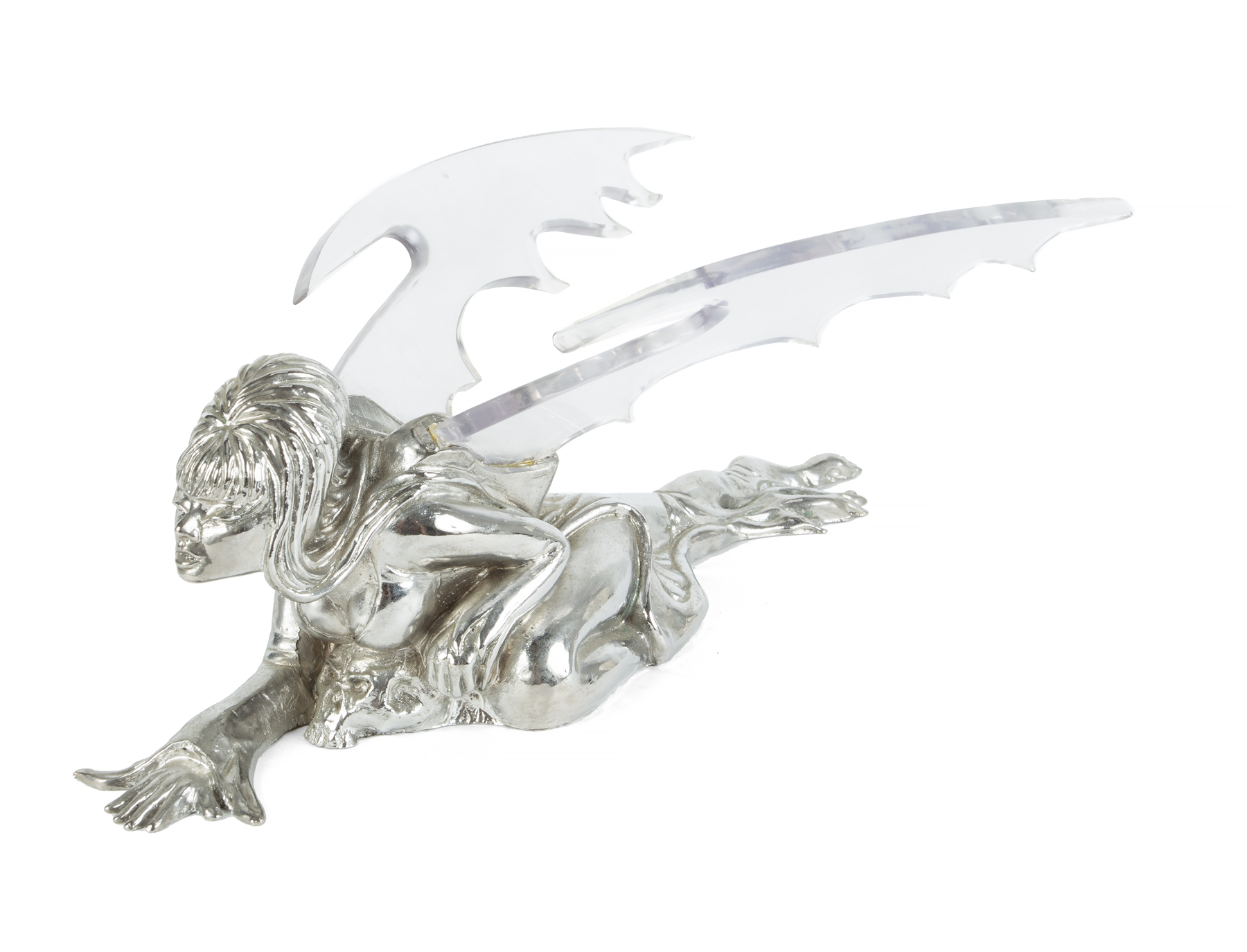 A custom chrome hood ornament depicting a crawling Elvira with acrylic bat wings. Designed by Brian Cooper for the famous George Barris Studios, this is an exact duplicate of the hood ornament used on the 'Macabre Mobile' -Elvira's 1959 Thunderbird --which was seen in the 1988 New World Pictures feature film Elvira: Mistress of the Dark. Peterson had two made at the same time, from the same mold, in case one got damaged or lost.