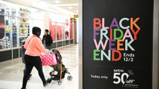 Holiday shoppers walking around during the Black Friday sales event at the Pentagon Centre shopping mall in Arlington, Virginia