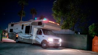 A RV pulls into a Safe Parking lot in Los Angeles.