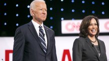 Joe Biden and Kalama Harris stand on stage.