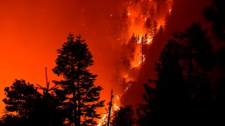 The Bobcat Fire burns near Cedar Springs in the Angeles National Forest on September 21, 2020 in Los Angeles, California. The fire, which erupted on September 6 in the Angeles National Forest, has become one of the largest fires in Los Angeles County’s history with over 100,000 acres scored by the fire. (Photo by FREDERIC J. BROWN/AFP via Getty Images)