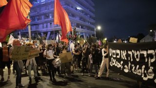 Israeli protestors gather on Saturday night in protest against Prime Minister Benjamin Netanyahu demanding his resignation over corruption cases and his failure to combat the new type of coronavirus (Covid-19) pandemic in West Jerusalem on October 31, 2020.