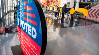 People vote at Staples Center.