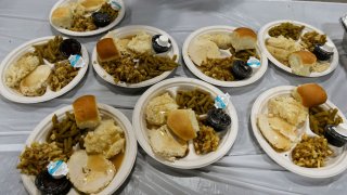File Image: Plates of Thanksgiving day dinner wait to be served (Photo by Helen H. Richardson/The Denver Post via Getty Images)