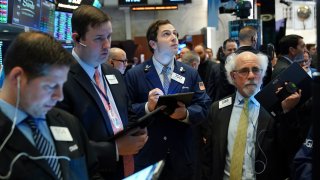 NEW YORK, NY – APRIL 24: Traders and financial professionals work on the floor of the New York Stock Exchange (NYSE) at the opening bell.