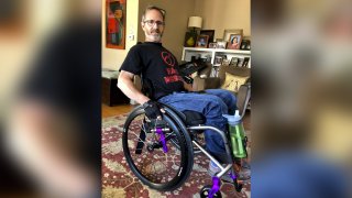 In this May 15, 2018 photo, Samuel Kolb poses for a photo in San Mateo, Calif. A Northern California county has agreed to pay nearly $10 million to settle a lawsuit by Kolb, who was going through a severe epileptic episode when a deputy shot him in the abdomen, paralyzing him from the waist down.