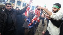 Iranians burn a U.S. flag during a demonstration against American "crimes" in Tehran on Jan. 3, 2020, following the killing of Iranian Revolutionary Guards Major General Qassem Soleimani in a strike on his convoy at Baghdad International Airport.