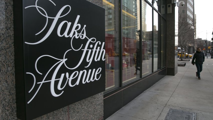 A pedestrian passes in front of the Saks Fifth Avenue Inc. women’s store.