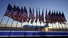 Air Force One is prepared for Donald Trump for his last ride as the President of the United States, as flags fly on a stage at Andrews Air Force Base, Maryland, Jan. 20, 2021.