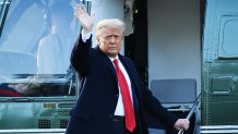 Outgoing President Donald Trump waves as he boards Marine One at the White House in Washington, D.C., on Jan. 20, 2021.