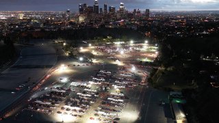 In an aerial view from a drone, motorists are lined up to receive vaccines at a mass COVID-19 vaccination site at Dodger Stadium.