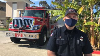 San Diego Fire Fighter Kyle O'Neill stands outside of Fire Station 28