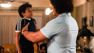 This image released by NBC shows Adrian Groulx as Dwayne Johnson, left, and Matthew Willig as Andre The Giant, in a scene from "Young Rock," premiering Feb. 16 on NBC.