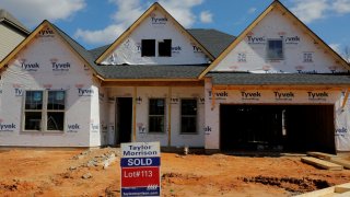 A home under construction stands behind a “sold” sign in a new development in York County, South Carolina, U.S., February 29, 2020.