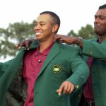 Tiger Woods, left, receives his Masters green jacket from last year's champion Vijay Singh of Fiji, after winning the 2001 Masters at the Augusta National Golf Club in Augusta, Ga., Sunday, April 8, 2001.