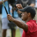 Tiger Woods celebrates on the 18th green after winning the Tour Championship golf tournament Sunday, Sept. 23, 2018, in Atlanta.