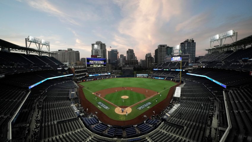 FILE - In this Oct. 6, 2020, file photo, the Tampa Bay Rays and the New York Yankees play in Game 2 of a baseball AL Division Series in an empty Petco Park in San Diego. Major League Baseball and all 30 of its teams are suing their insurance providers, citing billions of dollars in losses during the 2020 season played almost entirely without fans due to the coronavirus pandemic. The suit, filed in October in California Superior Court in Alameda County, was obtained Friday, Dec. 4, by The Associated Press. It says providers AIG, Factory Mutual and Interstate Fire and Casualty Company have refused to pay claims made by MLB despite the league's “all-risk” policy purchases.