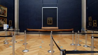 Leonardo da Vinci's Mona Lisa hangs on the wall in a deserted Louvre museum, in Paris.
