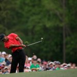 Tiger Woods tees off on the 12th hole during the fourth round of the Masters golf tournament Sunday, April 12, 2015, in Augusta, Ga.