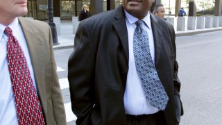 Former Chicago police Sgt. Ronald Watts, right, leaves the Dirksen U.S. Courthouse after being sentenced to 22 months in prison in 2013.