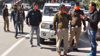 Police personnel prepare in Srinagar of Uttarakhand state on February 7, 2021 after a glacier broke off in Chamoli district causing flash floods in the Dhauli Ganga river.