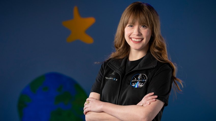 This Wednesday, Feb. 10, 2021 photo provided by St. Jude Children’s Research Hospital shows Hayley Arceneaux at the hospital in Memphis, Tennessee. On Monday, Feb. 22, 2021, the hospital announced that the 29-year-old physician assistant — a former patient hired the previous spring — will launch later this year alongside a billionaire who’s using his purchased spaceflight as a charitable fundraiser.