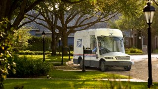 Photo of a greener USPS mail delivery truck by Oshkosh Defense.