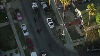 Police investigate a shooting on Sunday, Feb. 21, 2021.
