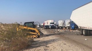 Yogurt cartons spilled onto the 15 Freeway in a big rig crash.