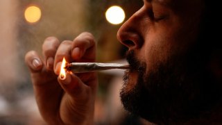 A customer lights a joint at Lowell Farms, America’s first official Cannabis Cafe offering farm-to-table dining and smoking of cannabis in West Hollywood, California, October 1, 2019.