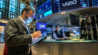 Traders work on the floor of the New York Stock Exchange.