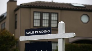A sale pending sign is posted in front of a home for sale on July 17, 2014 in San Francisco, California.