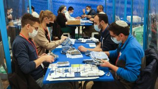Electoral staff count ballots in Israel's general elections in Jerusalem on March 25, 2021.