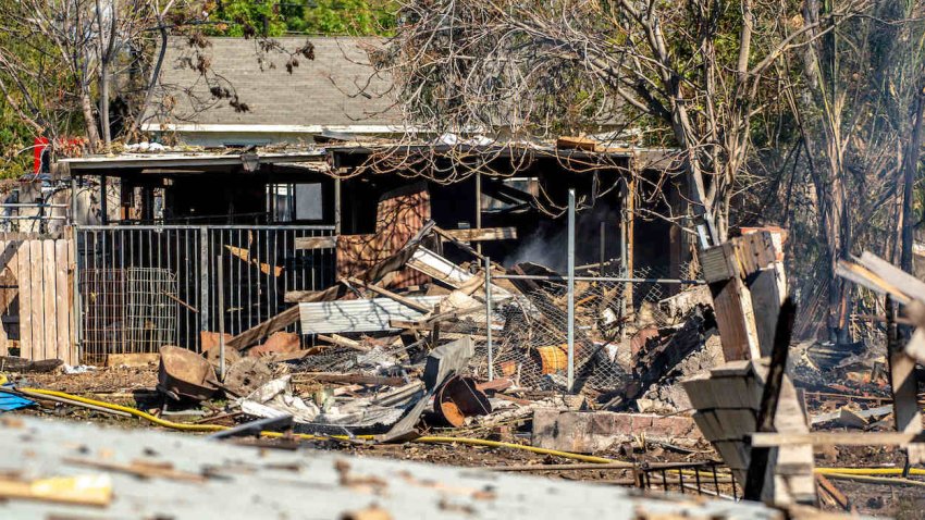 Debris and rubble in the back of a destroyed home.